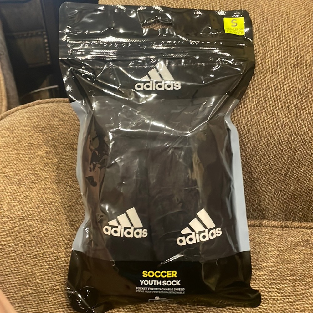 Rarely used Adidas soccer shin guards, size small
